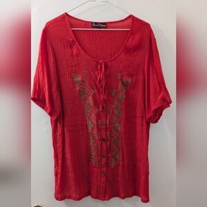 Claire's Vibrant Red Blouse with Geometric Design